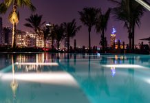 Float the evening away with The Club’s unique night swim experience this summer